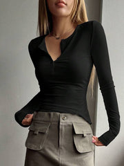 T-shirt med långa ärmar med halv knapp för kvinnor